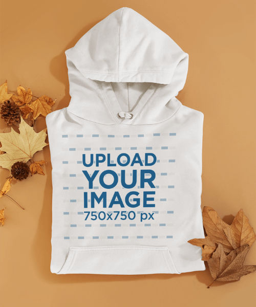 Mockup Of A Folded Hoodie Among Some Autumn Leaves