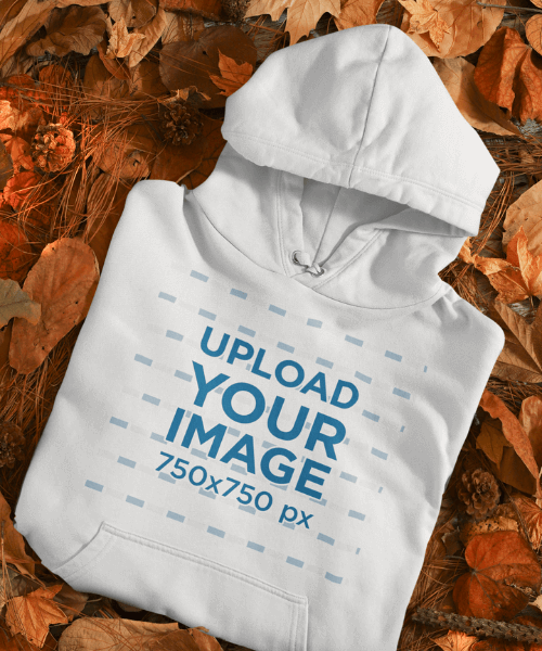 Mockup Of A Folded Pullover Hoodie Placed Over Autumn Leaves