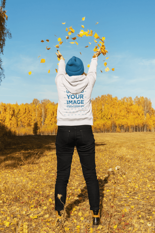 Back View Hoodie Mockup Of A Woman Playing With Autumn Leaves