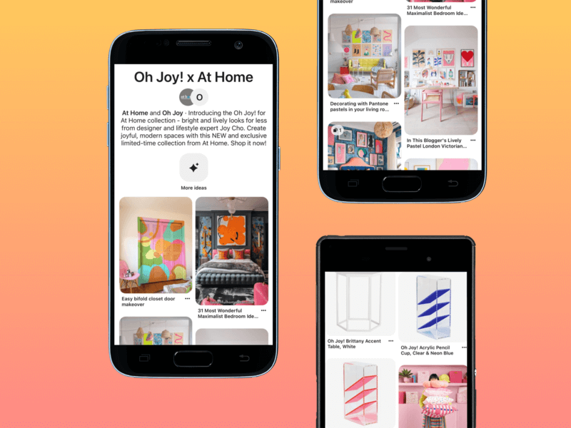 Black Android Phones In Portrait Position Over A Png Background Showcasing Oh Joy's Collab Collection