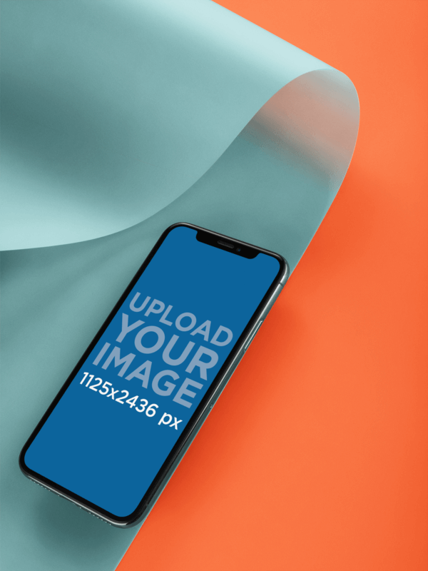 Black iPhone X Mockup Lying On A Bent Semi Transparent Pasteboard For An App Promotion