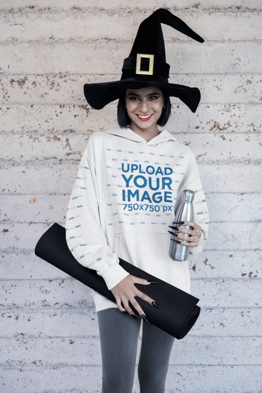 Halloween Themed Hoodie Mockup Of A Woman With A Witch Hat On Her Way To Yoga