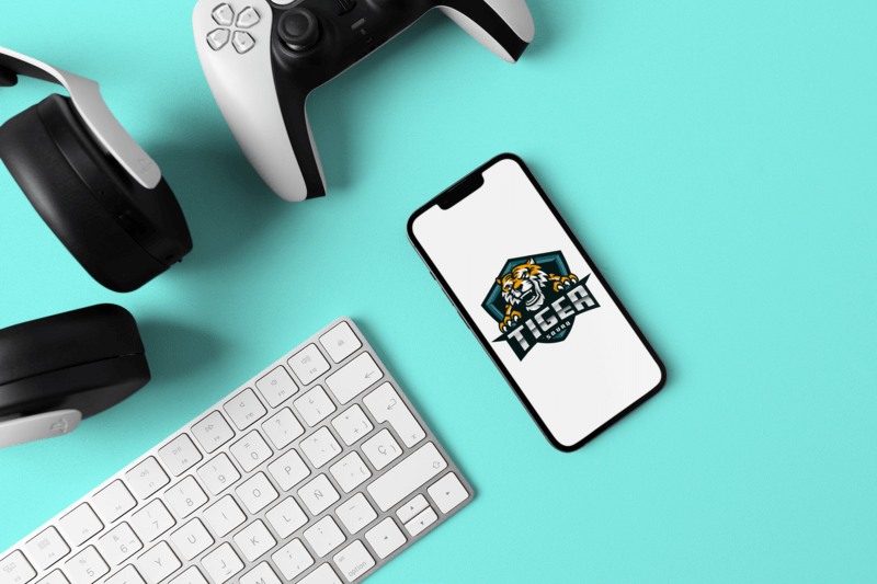 Iphone 13 Mockup With A Gaming Logo Featuring A Gaming Controller And A Customizable Background