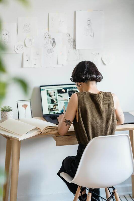 Photo Of A Female Freelancer Using Netbook In Light Workshop By Pexels