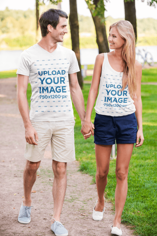 Tank Top And V Neck T Shirt Mockups Featuring A Smiling Couple Holding Hands And Walking In The Park