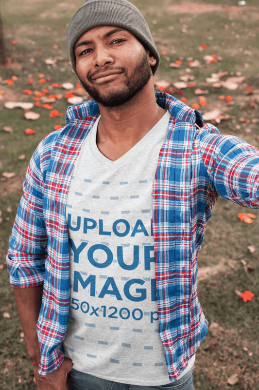 V Neck T Shirt Mockup Of A Bearded Man Taking A Selfie In The Park