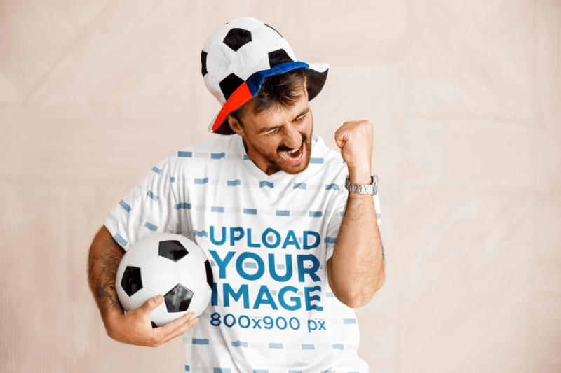 V Neck T Shirt Mockup Of An Excited Man With A Soccer Ball