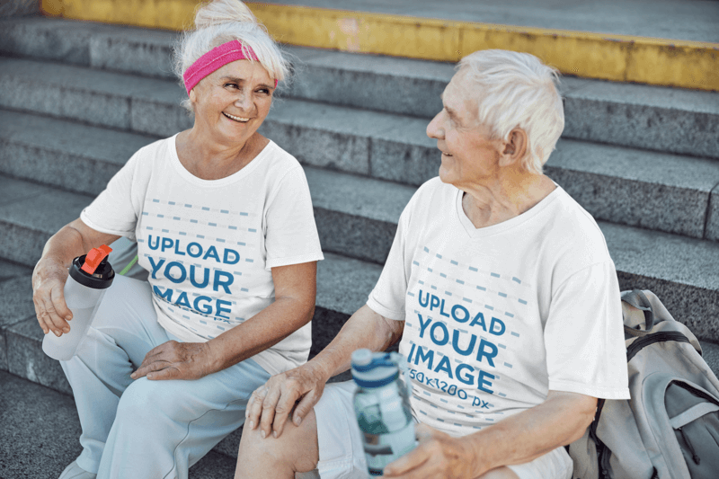 V Neck T Shirt Mockups Featuring A Happy Elderly Couple Drinking Water After A Workout