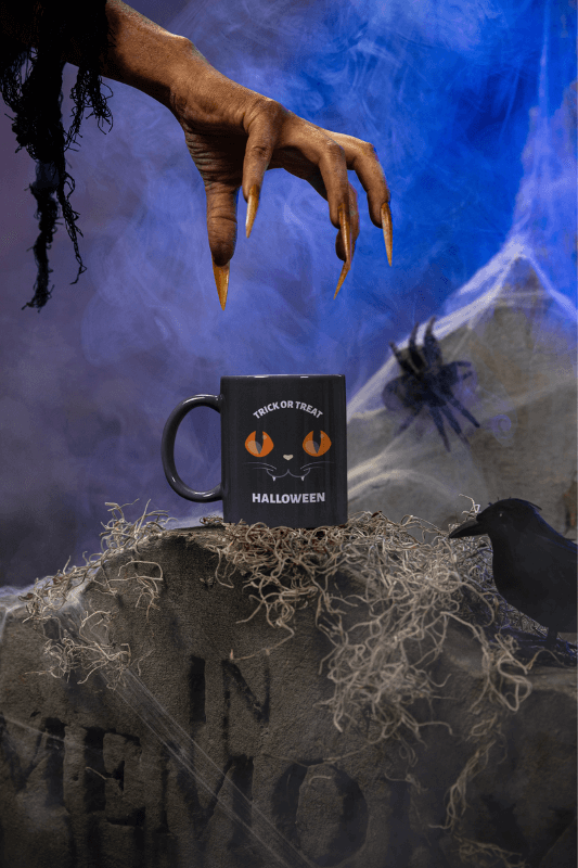 Coffee Mug Mockup Featuring A Monster Hand In A Spooky Setting