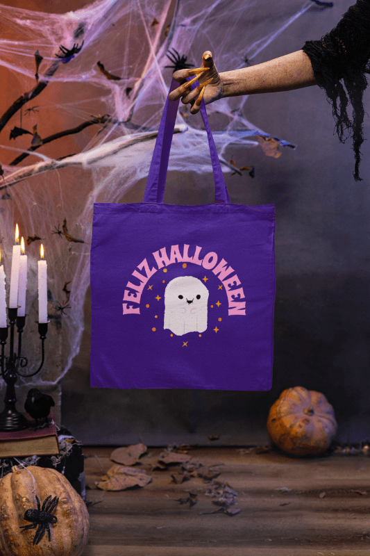 Halloween Inspired Mockup Featuring A Witch's Hand Holding A Tote Bag