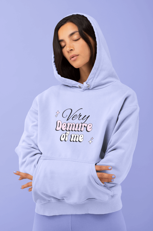 Apparel Mockup Of A Woman Comfortably Wearing A Hoodie With A Purple Background