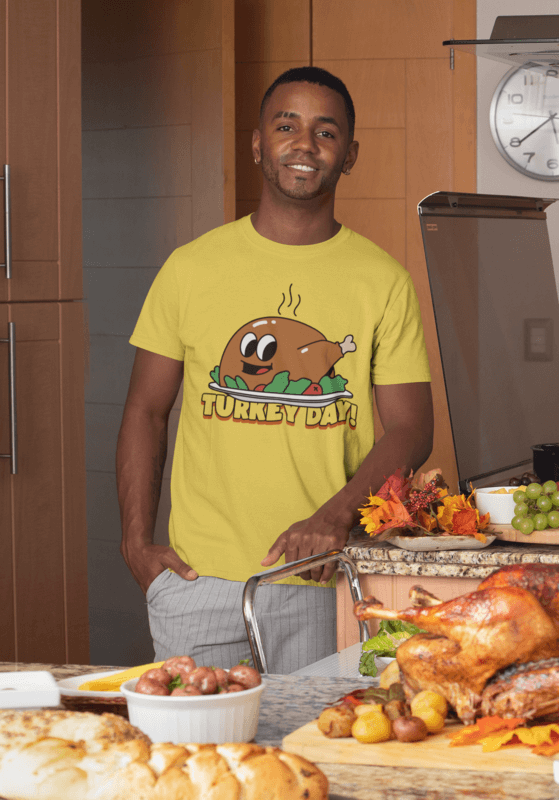 Mockup Of A Smiling Man Wearing A Customizable Thanksgiving T Shirt During A Dinner