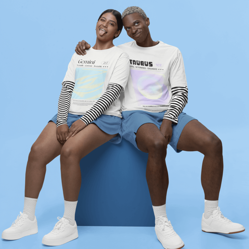 Stanley Stella T Shirt Mockup Featuring A Happy Man And Woman Sitting On Studio Against A Blue Backdrop