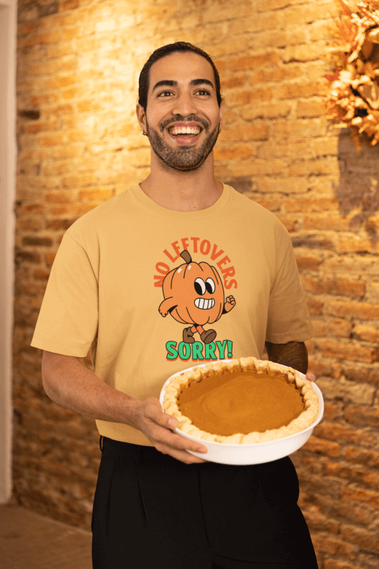 Stanley Stella Thanksgiving T Shirt Mockup Of A Happy Man Holding A Pumpkin Pie