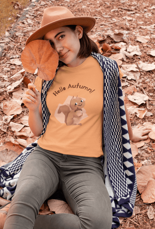 Thanksgiving T Shirt Mockup Of A Woman Sitting On A Field With Fall Leaves