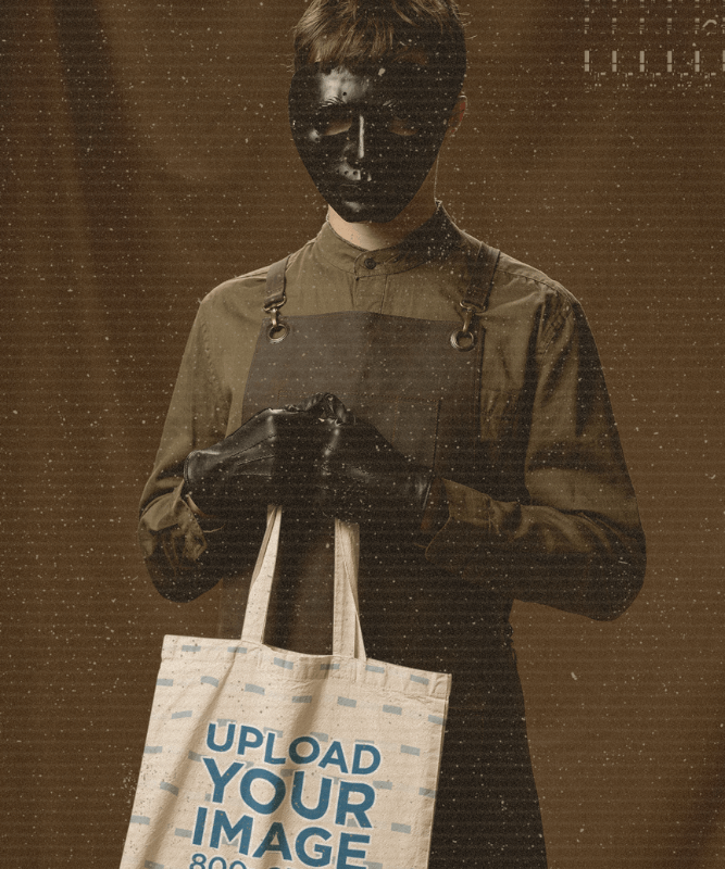 Mockup Of A Man With A Creepy Halloween Mask Holding A Tote Bag