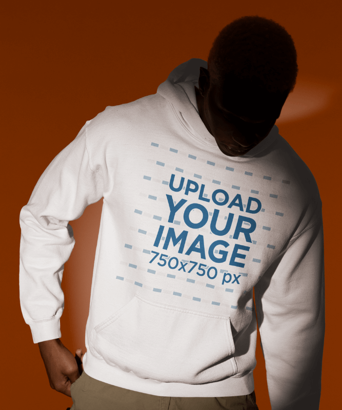 Spotlight Themed Mockup Of A Man Wearing A Gildan Pullover Hoodie In A Studio