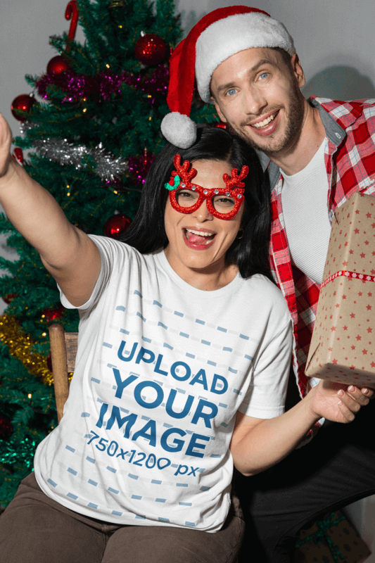 Bella Canvas T Shirt Mockup Featuring A Cheerful Woman Celebrating Christmas With A Friend