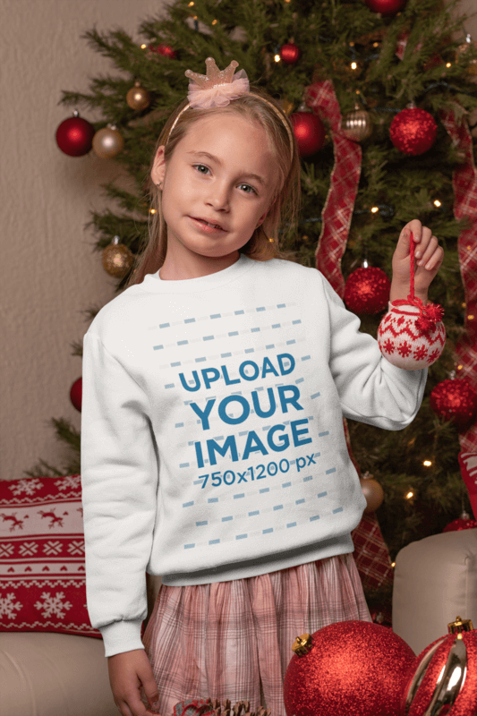 Blank Sweatshirt Mockup Featuring A Little Girl By A Christmas Tree