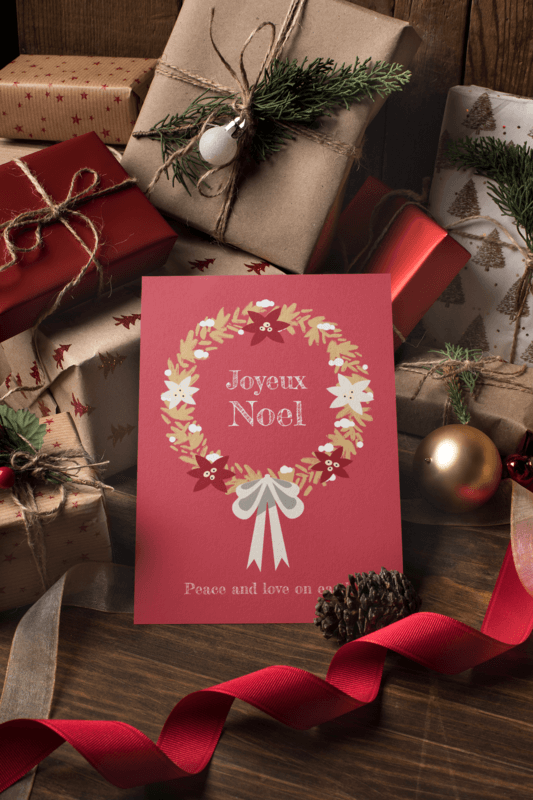 Christmas Holiday Card Mockup Featuring A Holiday Quote With Ornaments And Gifts