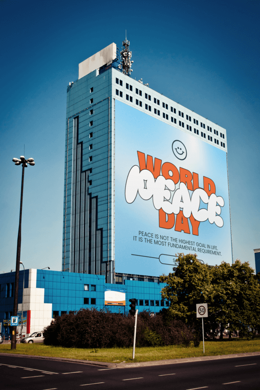 Mockup Of A Billboard Placed On A Tall Building With A World Peace Day Design