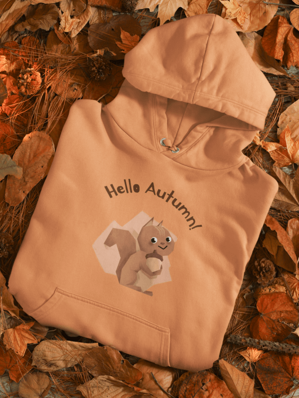 Mockup Of A Folded Pullover Hoodie With A Thanksgiving Design Placed Over Autumn Leaves