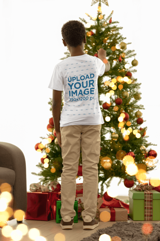 Back View Tee Mockup Of A Boy Placing A Sphere On A Christmas Tree