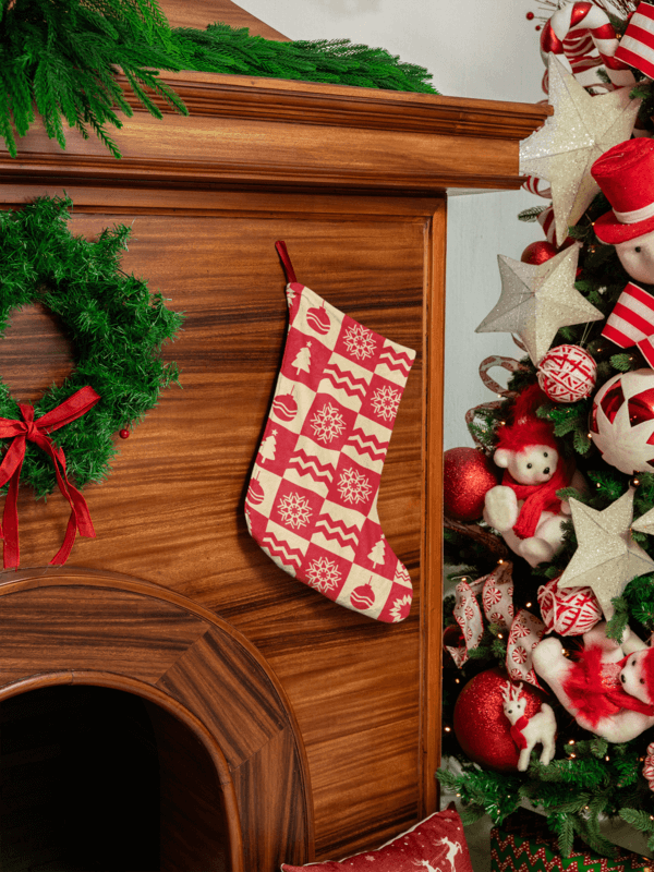 Christmas Stocking Mockup Featuring A Wooden Fireplace And Holiday Decorations