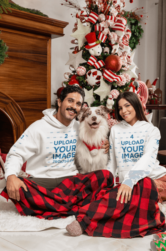 Gildan Hoodie Mockup Of A Man And A Woman Posing With A Dog Against A Xmas Tree