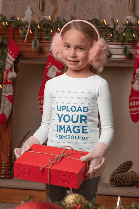 Mockup Of A Girl Wearing A Long Sleeve Tee While Holding A Christmas Present