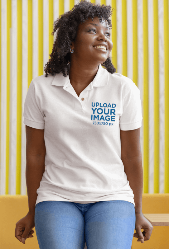 Polo Shirt Mockup Featuring A Curly Haired Woman Leaning Over A Table