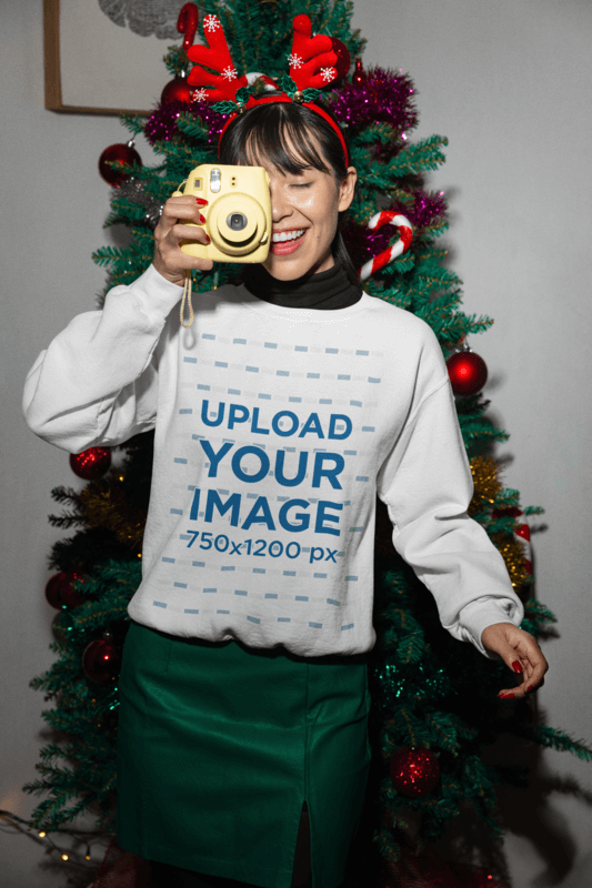 Xmas Themed Gildan Sweatshirt Mockup Of A Woman Taking A Picture With An Instant Camera