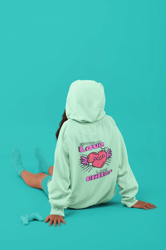 Back View Mockup Of A Woman With A Sweatshirt Sitting On A Studio's Floor