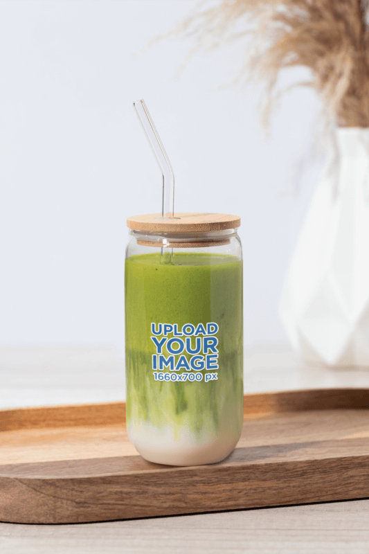 Can Glass Mockup Featuring A Matcha Tea Beverage In A Wooden Surface