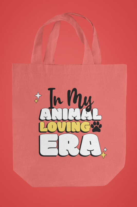 Simple Mockup Of A Tote Bag With An Animal Phrase And A Red Background