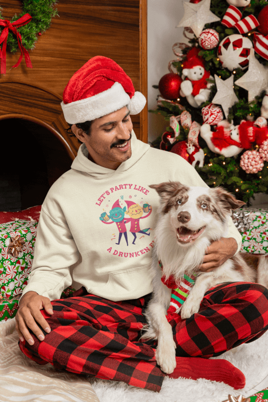 Gildan Hoodie Mockup Featuring A Man Posing With His Dog In A Christmas Themed Setting