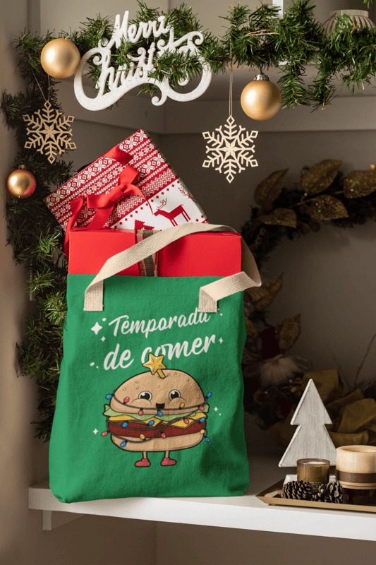 Mockup Featuring A Tote Bag Placed On A Shelf Near Some Christmas Decorations