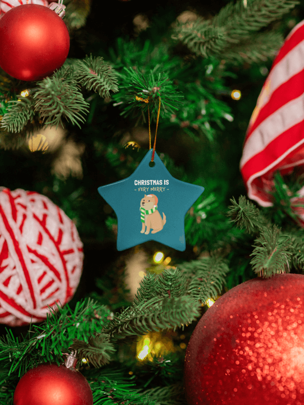 Print Mockup Of A Ceramic Star Shaped Ornament Placed On A Decorated Christmas Tree