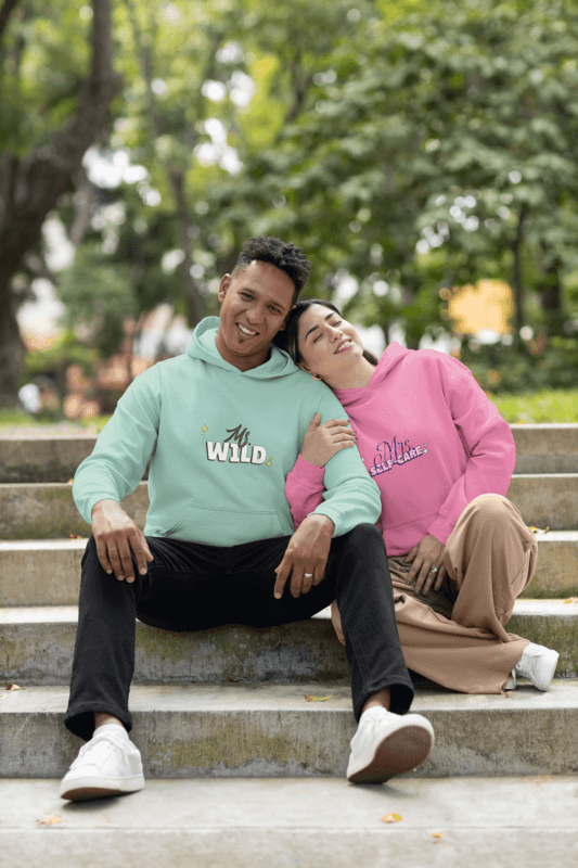 Gildan Pullover Hoodie Mockup Of A Happy Couple Sitting Together At A Park