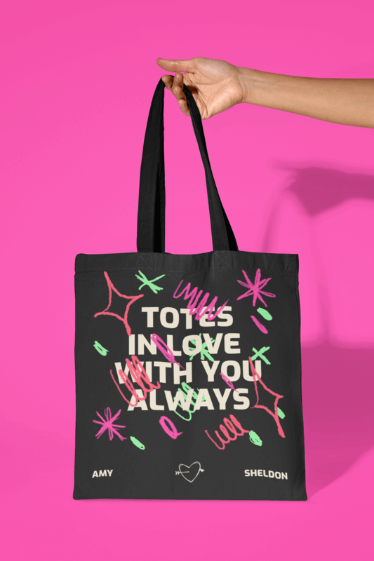 Mockup Of A Person Holding A Sublimated Tote Bag Against A Colorful Pink Background