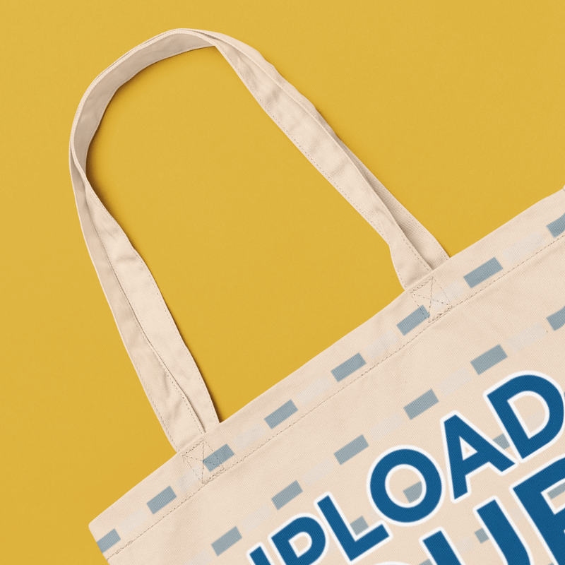 Mockup Of A Sublimated Econscious Tote Bag Placed On A Colorful Surface