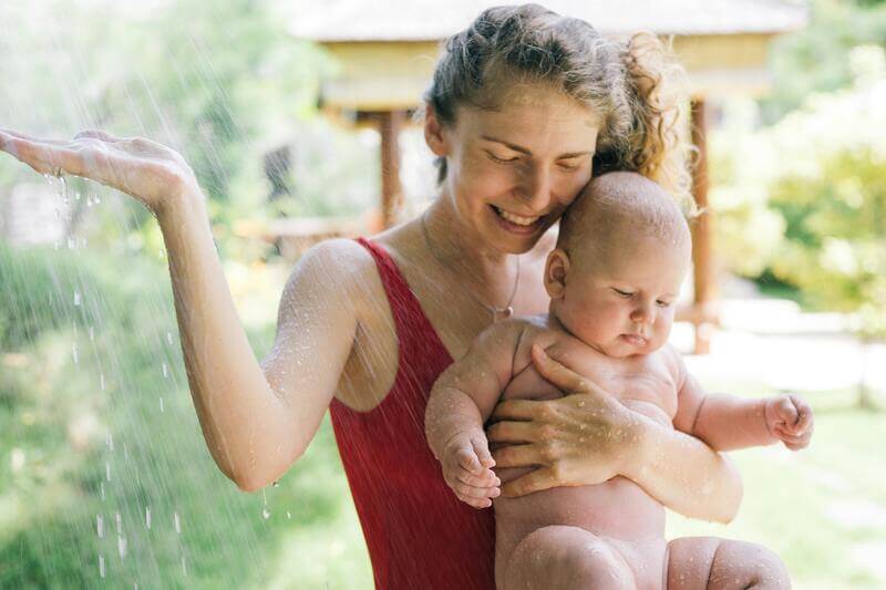 Photo Of A Woman Holding Her Baby By Pexels