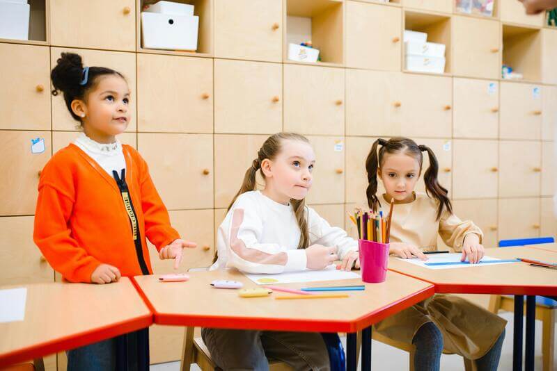 Photo Of Three Young Girls At School By Pexels