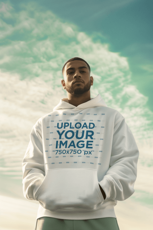 Pullover Hoodie Mockup Featuring An AI Created Man Posing Against The Sky