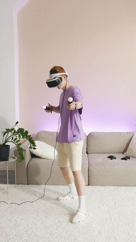 Photo Of A Teenager Playing With A VR Headset