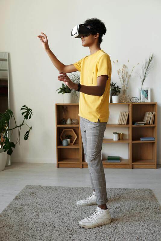 Photo Of A Teenager Using A VR Headset By Pexels