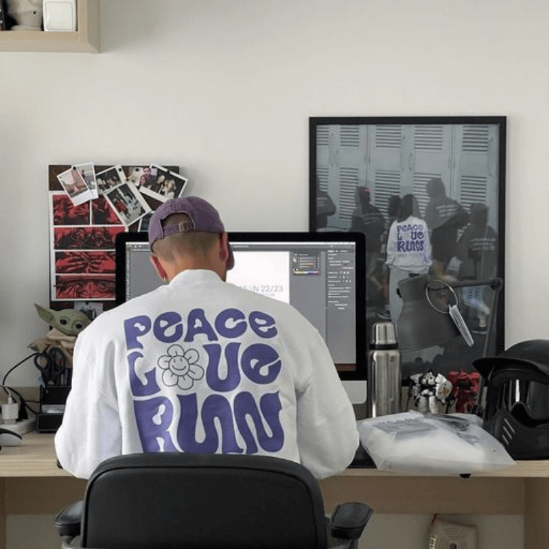 A Print On Demand Seller Wearing His Creations While Working On A New Pod Design