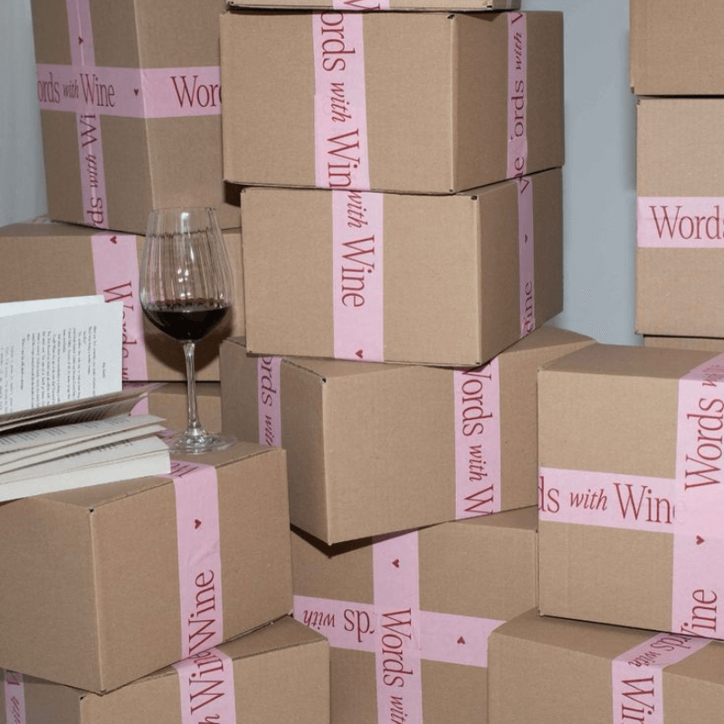 A Zoom In Of Various Print On Demand Boxes With A Pink Ribbon