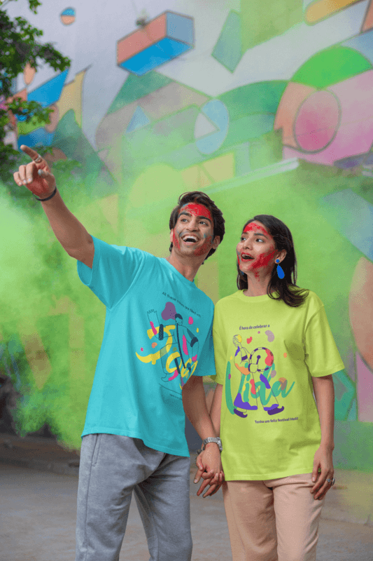 Blinkstore T Shirt Mockup Of A Happy Man And Woman With Painted Faces Celebrating Holi