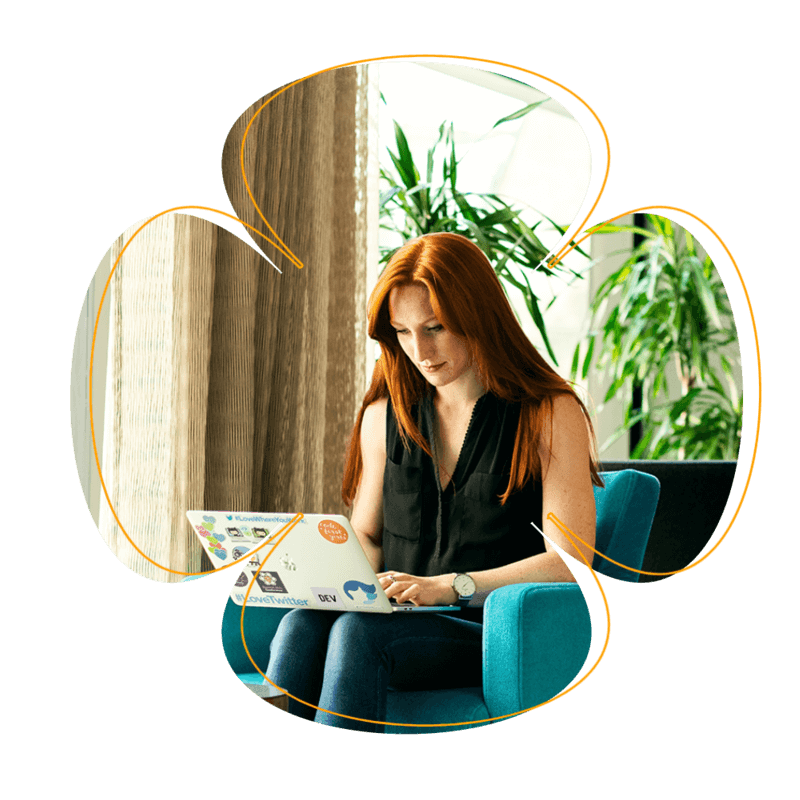 Flower Design With A Photo Background Of A Woman Working On A Laptop